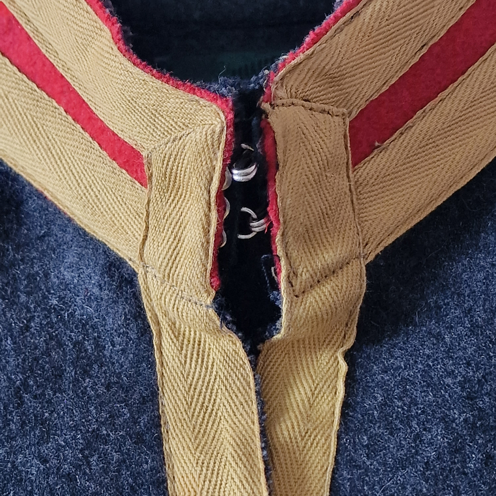 Closeup of Junior Gaultier military jacket.