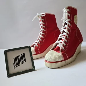 Red high top canvas boots with wedge heel