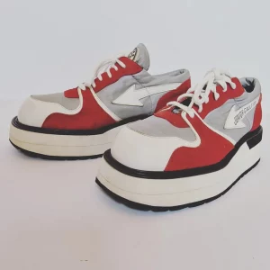 Vintage red and white Junior Gaultier trainers.