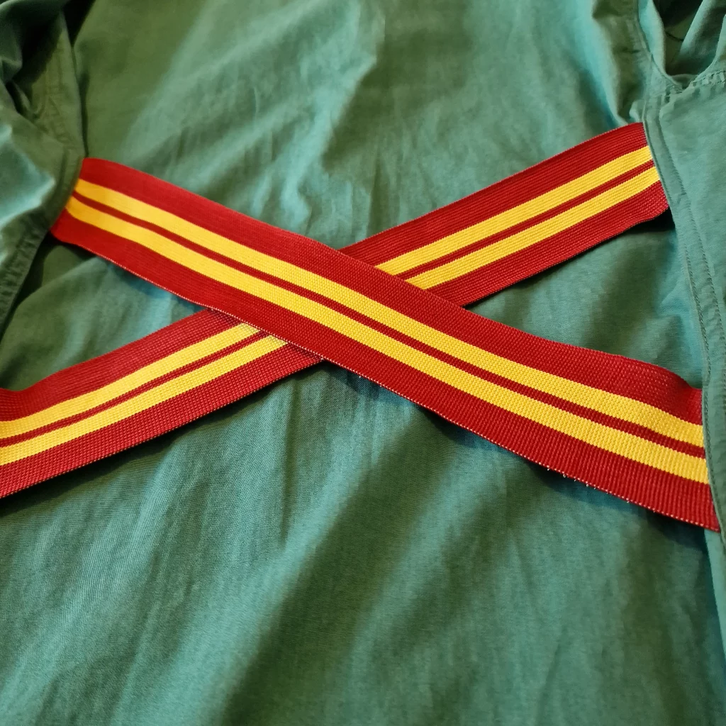 Closeup of the elastic straps on the back of a jacket.