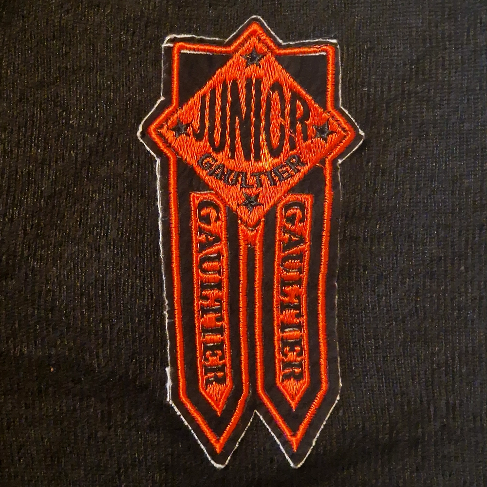 A patch with the words Junior Gaultier.