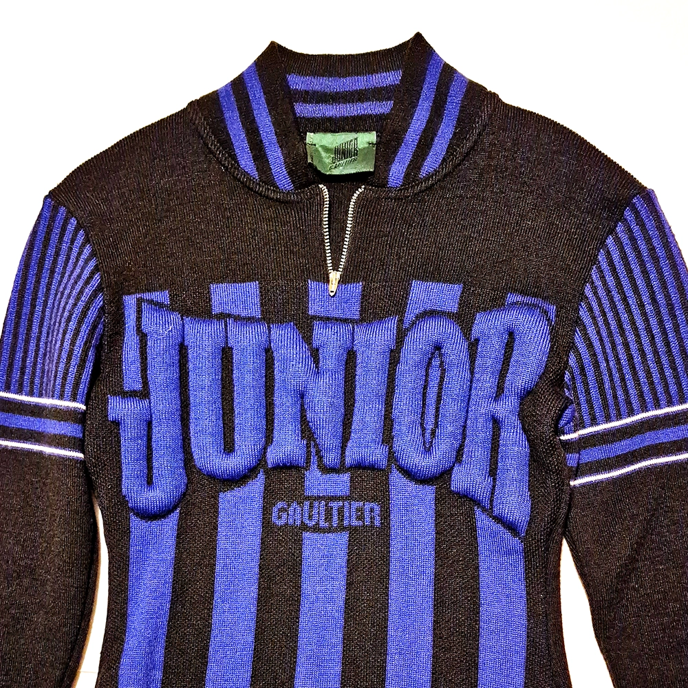 Blue and black striped jumper.