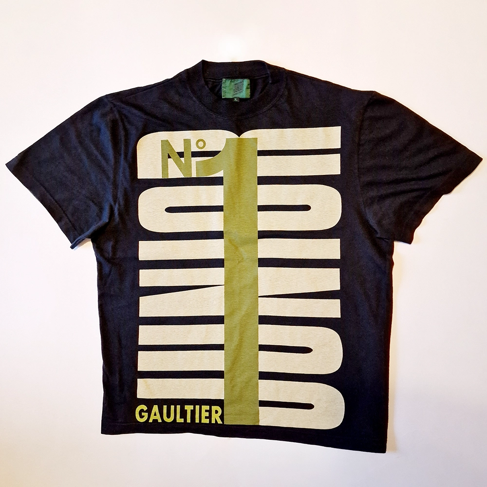Black T-shirt with Graphics made up of text.