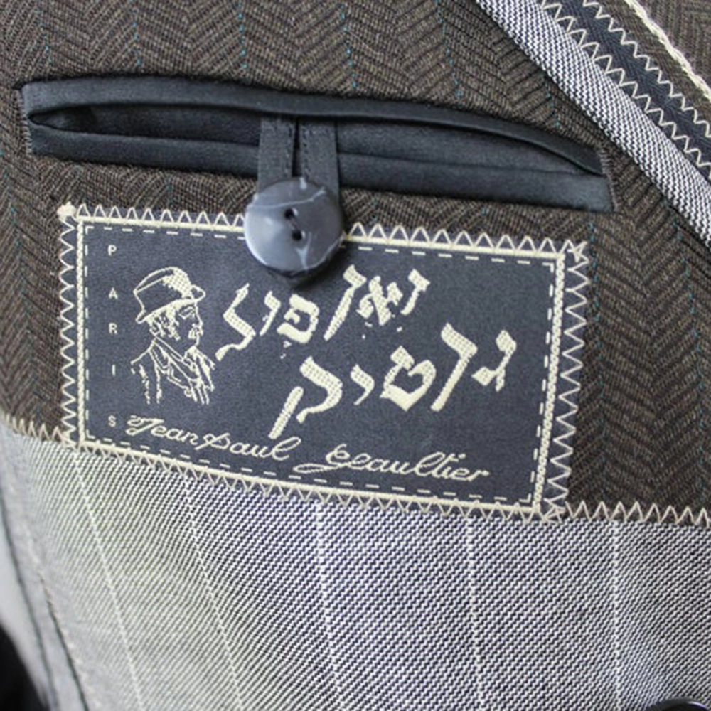 Closeup of the breast pocket of a Chic Rabbis jacket with tailor's label.