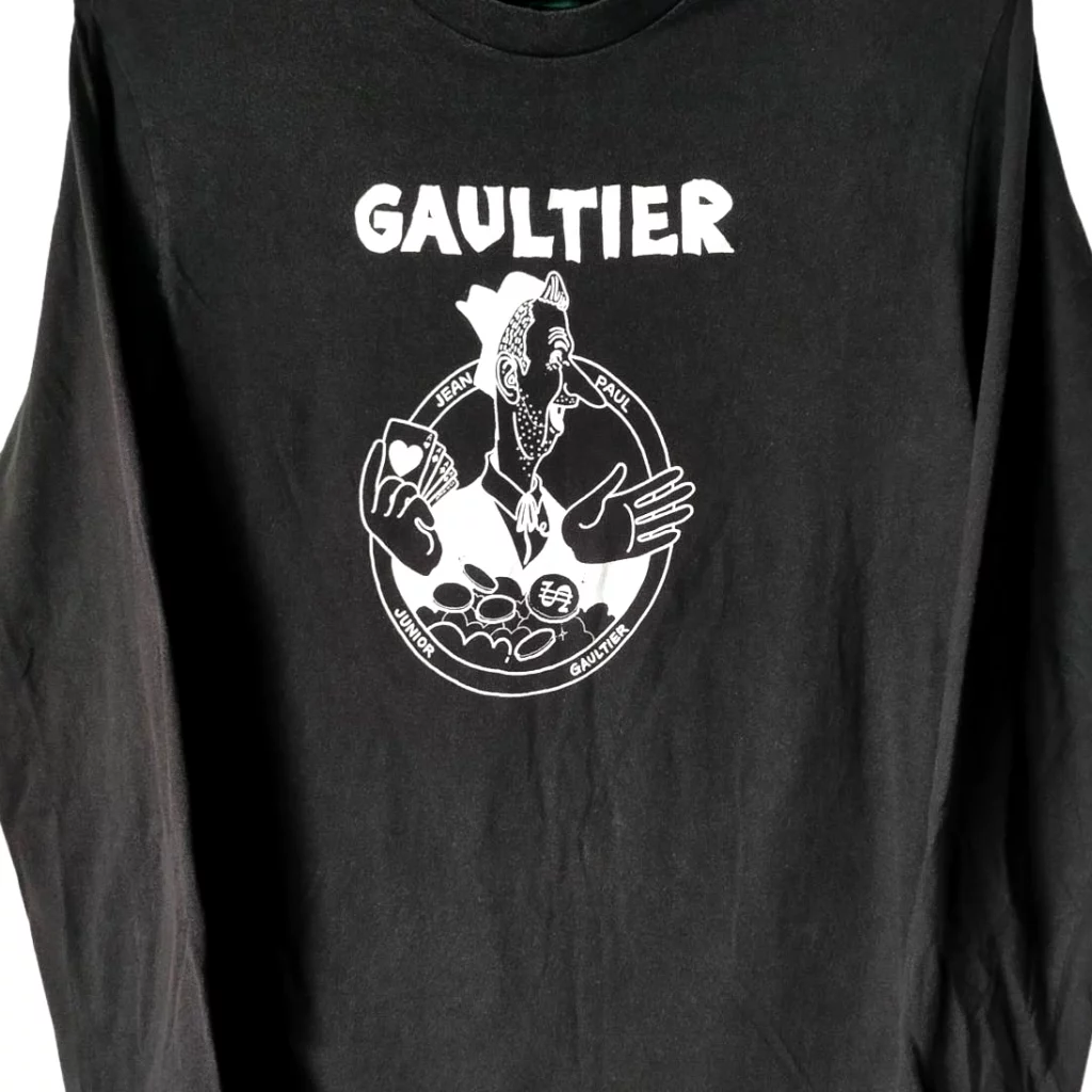 Black T-shirt with white outlined cartoon character.