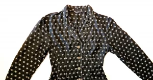 A black jacket with skull embroidered patterns.