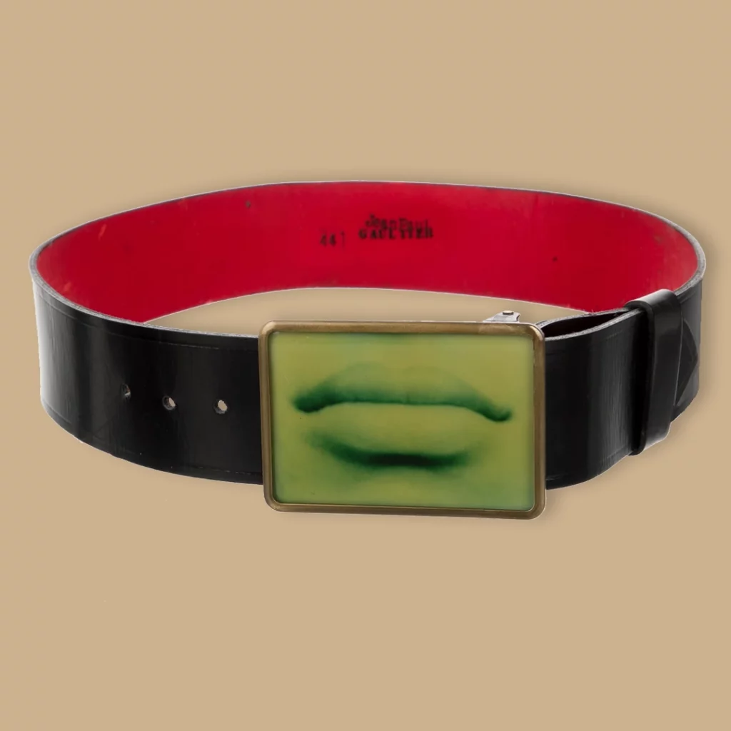 A belt with a buckle featuring a photo of a pair of lips.