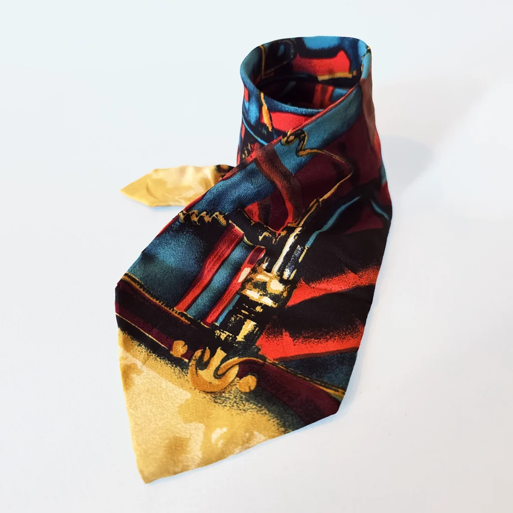 Tie with bold colourful metallic elements.