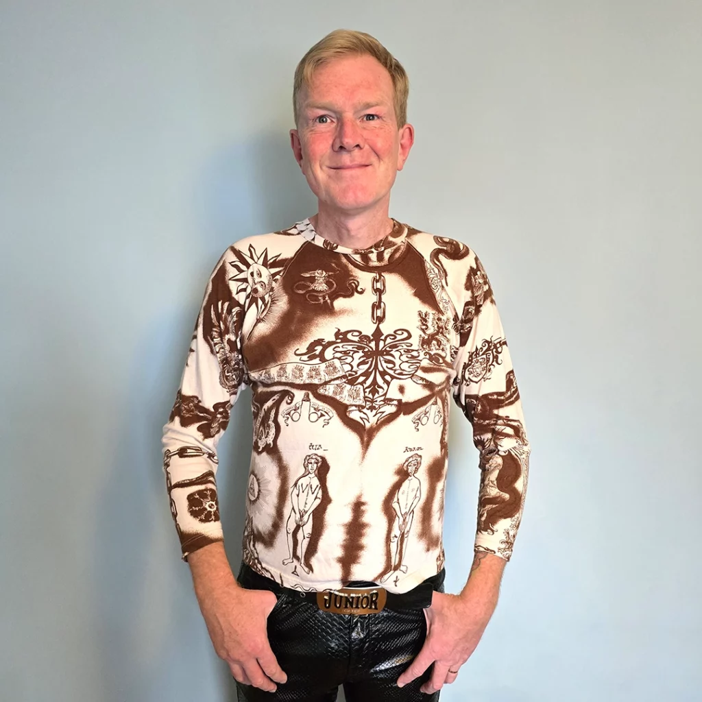 Person wearing T shirt with multiple tattoo patterns on