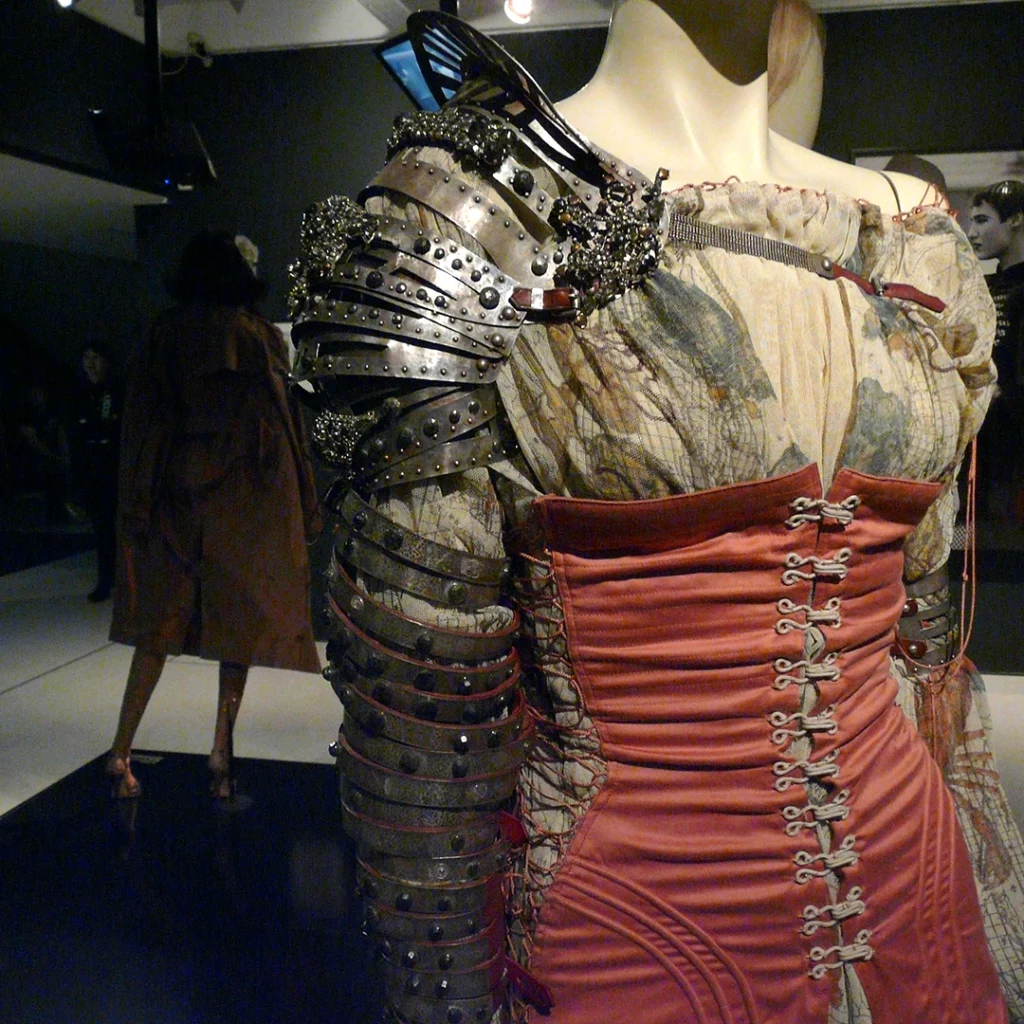 Corset dress on mannequin with armour on one arm