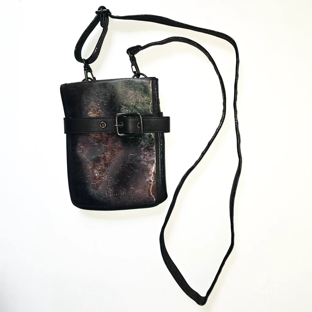 Iridescent rust effect bag with carry strap