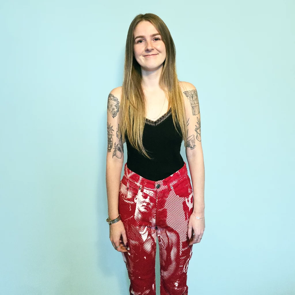 Lady wearing jean with halftone print of skin heads