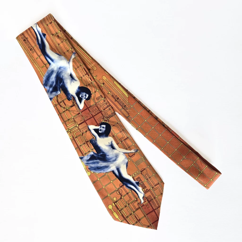 Tie featuring two renaissance women over a circuitboard background.