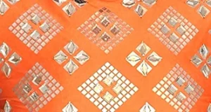 Close up of gemstones on orange material